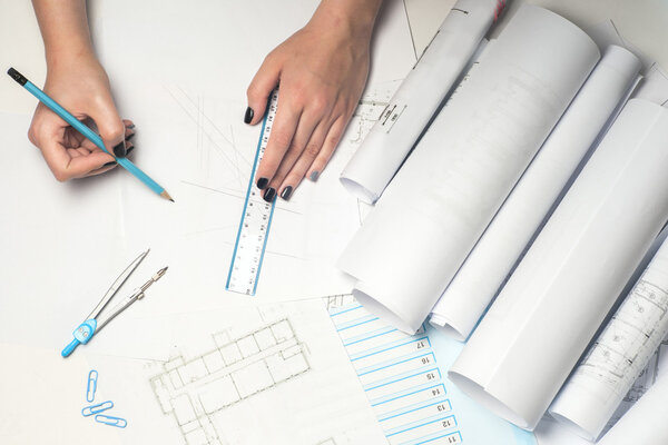 Architect working on blueprint.