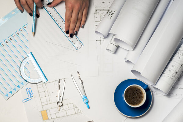 Architect working on blueprint.