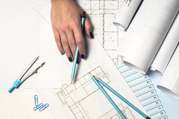 Architect working on blueprint.