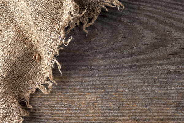 burlap hessian sacking on wooden background