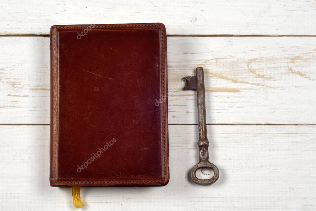 old keys on book, antique wood background
