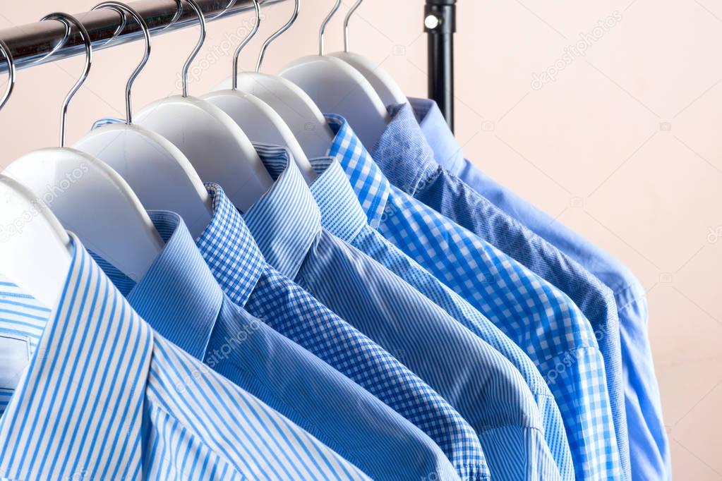 Cloth Hangers with Shirts. Men's clothes