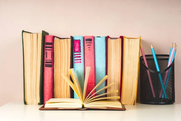 Open book, hardback books on bright colorful background. — Stock Photo, Image