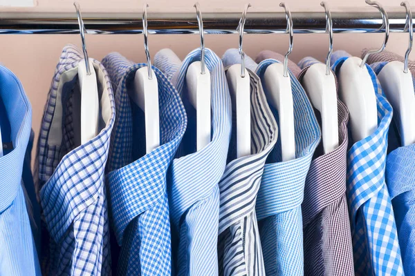 Cloth Hangers with Shirts. Mens clothes — Stock Photo, Image