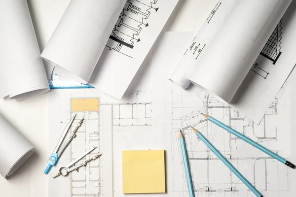 Workplace of architect - rolls and plans. — Stock Photo, Image