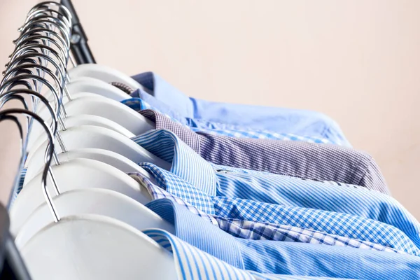 Cloth Hangers with Shirts. Mens clothes — Stock Photo, Image