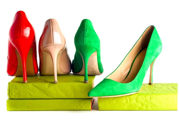 Bright, multicolored female shoes on high heels isolated on white background. — Stock Photo, Image