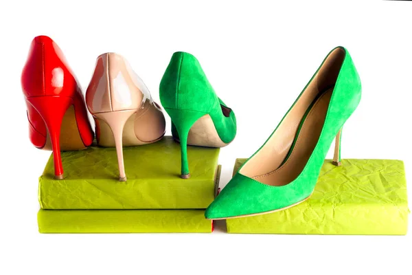 Bright, multicolored female shoes on high heels isolated on white background. — Stock Photo, Image