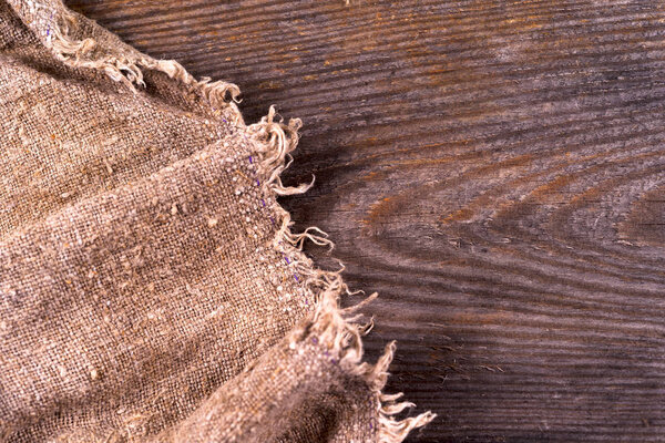burlap hessian sacking on wooden background