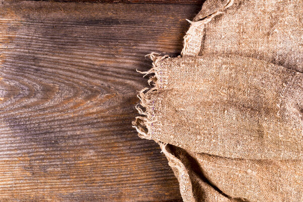 burlap hessian sacking on wooden background