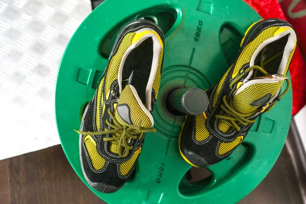 Unbranded modern sneaker in the gym. Black-Yellow. Comfortable shoes.