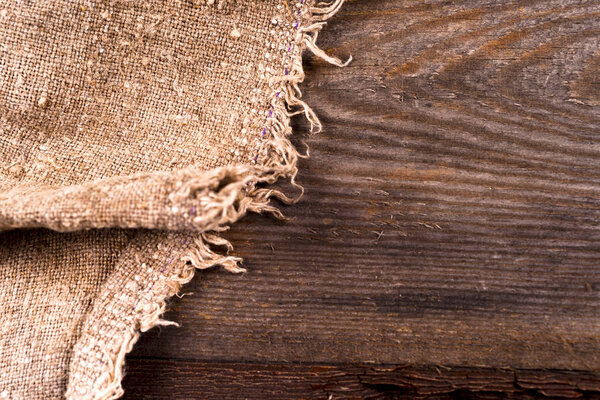 burlap hessian sacking on wooden background