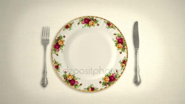 Empty Plate Knife and Fork on a White Table Cloth in Stop Motion — Stock Video