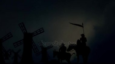 Don Kişot ve önünde duran yel değirmenleri fırtınalı bir günde Sancho Panza