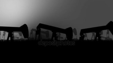 Kirli bir ortamda bir petrol sahası içinde petrol pompaları silüeti