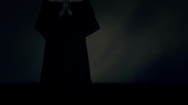 Nun Wearing Veil Standing in a Praying Pose Under Rain and Lightning Storm — Stok Video