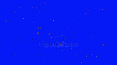 Kameradan uzak bir mavi ekran arka plan üzerinde uçan kıvılcım ateş