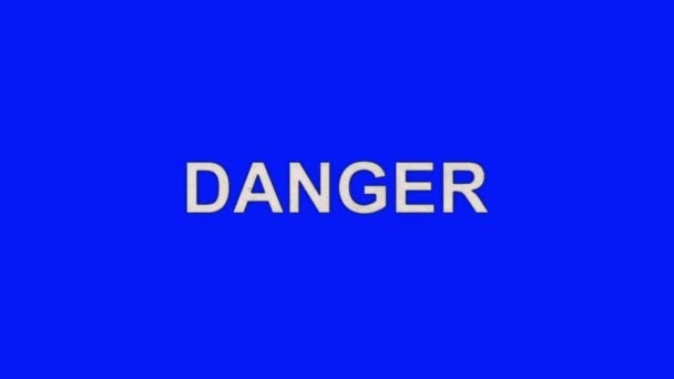 La palabra peligro ardiendo en llamas a cenizas en un fondo de pantalla azul — Vídeo de stock