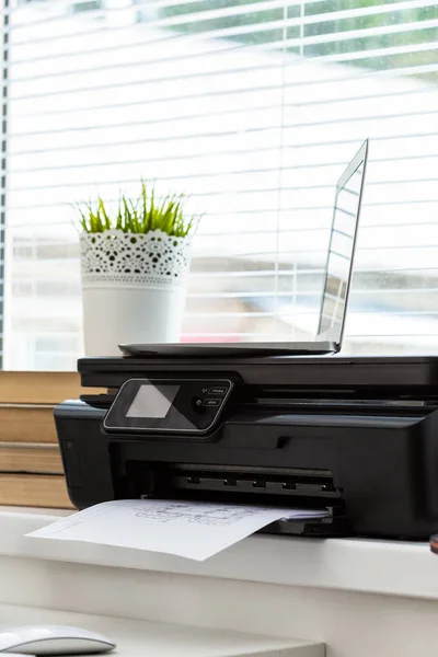 Printer and computer on the desk