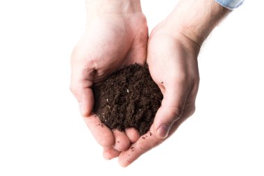 Zengin kahverengi toprak tutan el