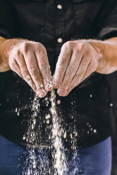 man baker works with flour