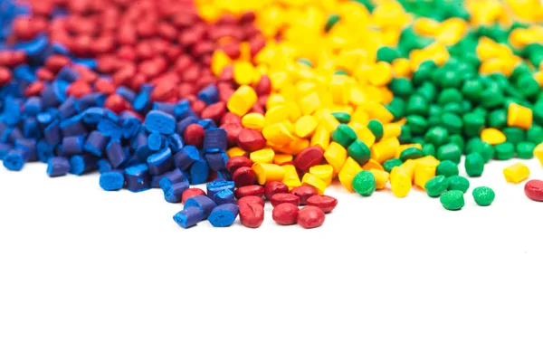 Colorful tinted plastic granulate — Stock Photo, Image