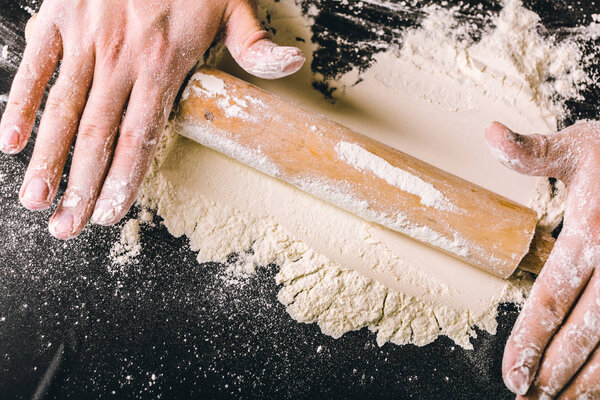 Hands making dough