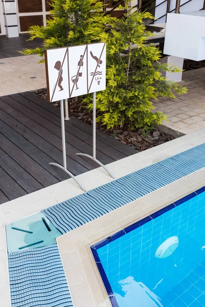 Signboard with cautions near Pool — Stock Photo, Image