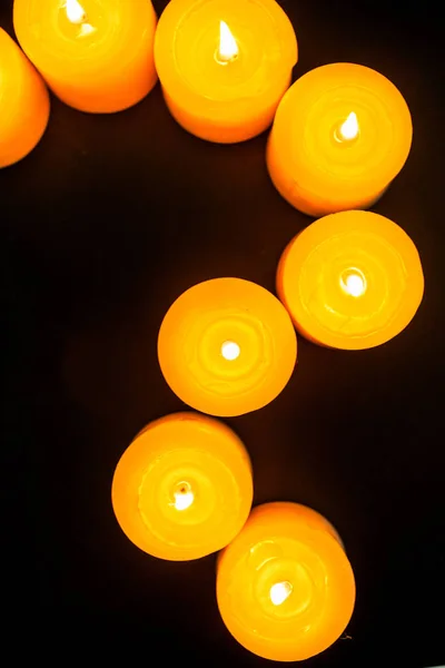 Burning yellow candles — Stock Photo, Image