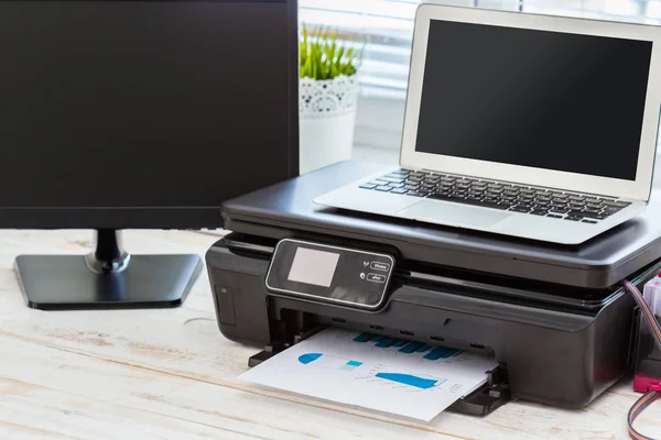 Printer and computer on the desk