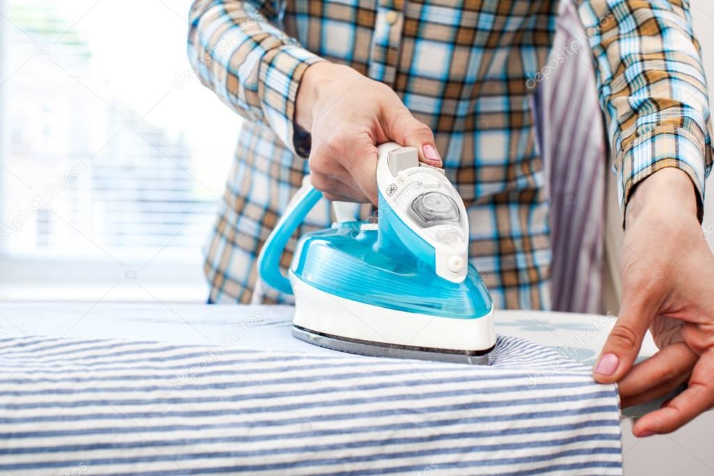 Woman ironing clothes