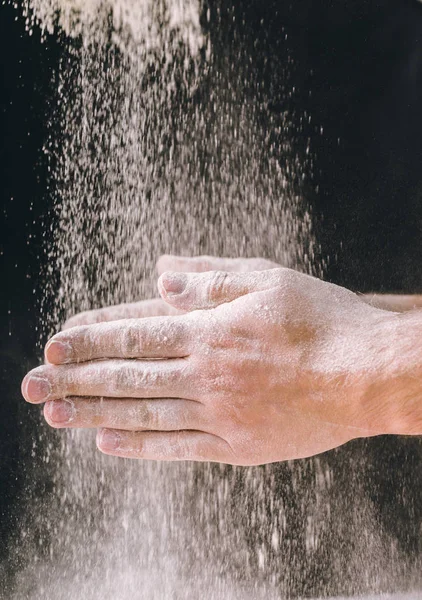 man baker works with flour