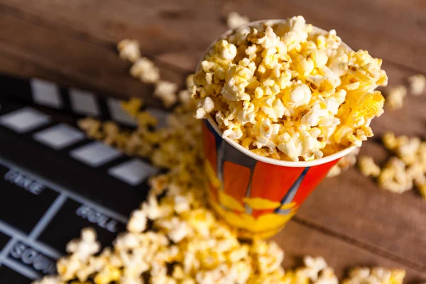 Movie clapper and pop corn