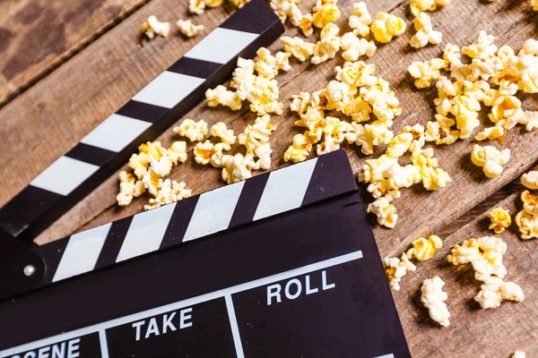 stock image Movie clapper and pop corn