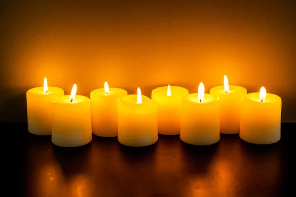 Burning yellow candles — Stock Photo, Image