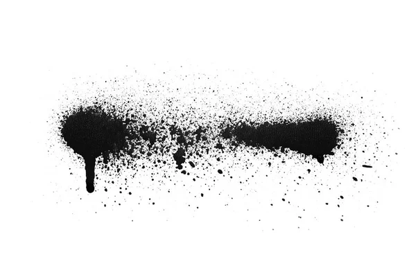 Black color spray paint on a white background paper — Stock Photo, Image