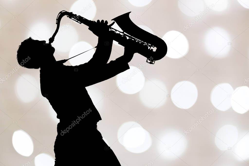 Jazz saxophone player in performance on the stage.