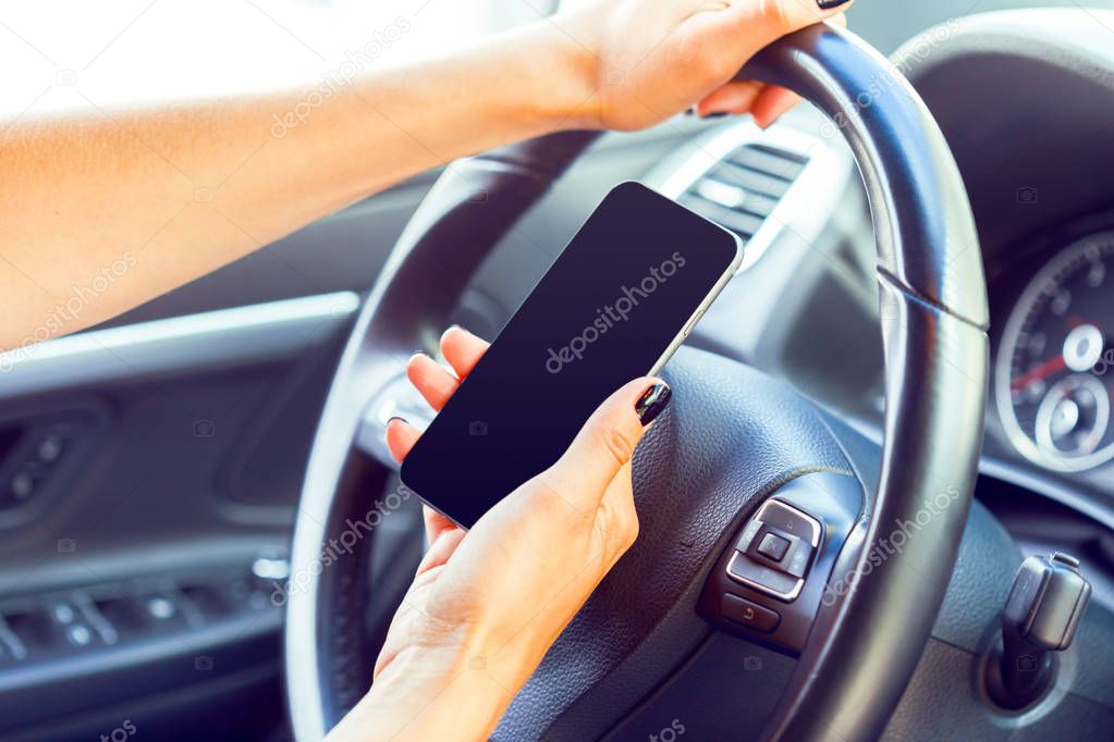 female driver using a cellphone