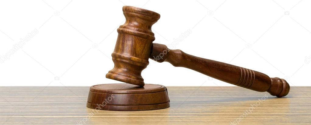 Wooden gavel on the table close up