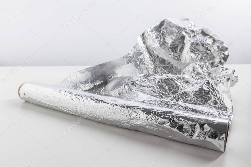 roll of aluminum foil isolated on white background