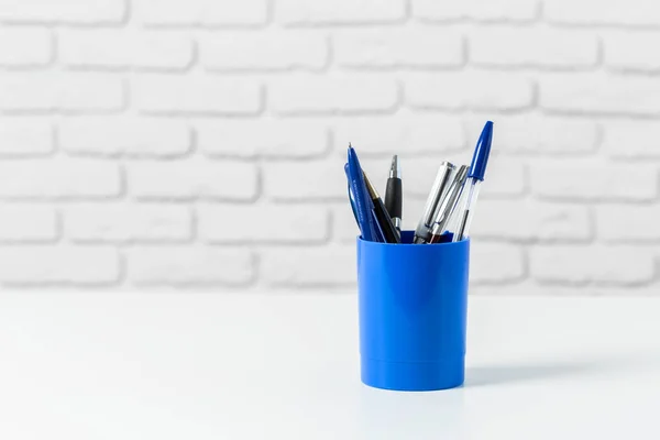 pens or writing tools on white table