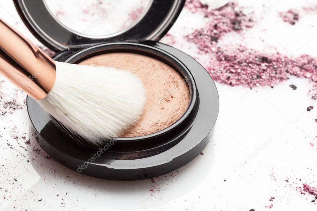 Makeup brush and powder, close up