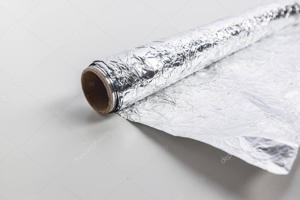 roll of aluminum foil isolated on white background