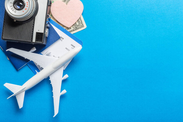 Miniature airplane on colourful background for travel theme