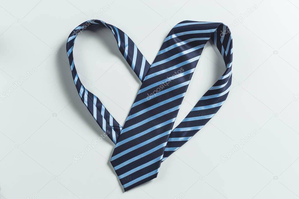 Fashionable male tie over white background