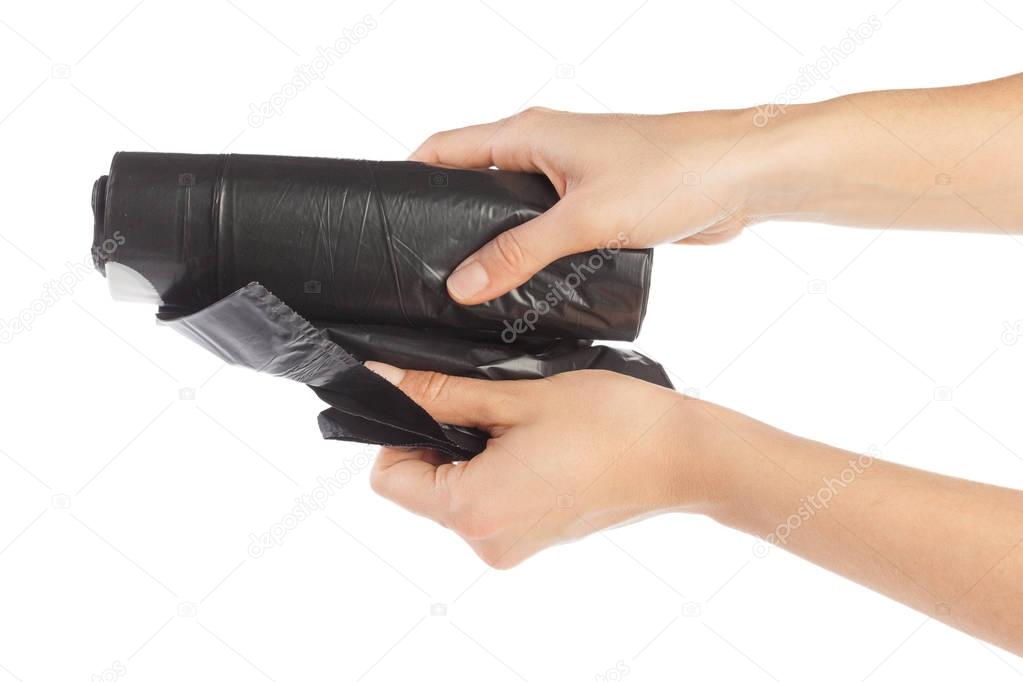 woman hands holding garbage bag isolated on white background