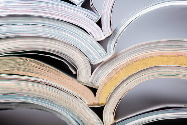 stack of colorful magazines close up