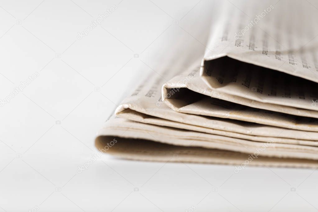 newspaper close up on white background