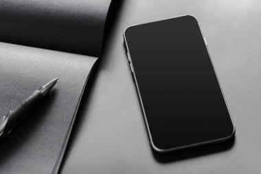 Mockup boş kitap ve cep telefonu