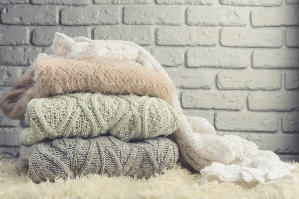 Stack of cozy knitted sweaters